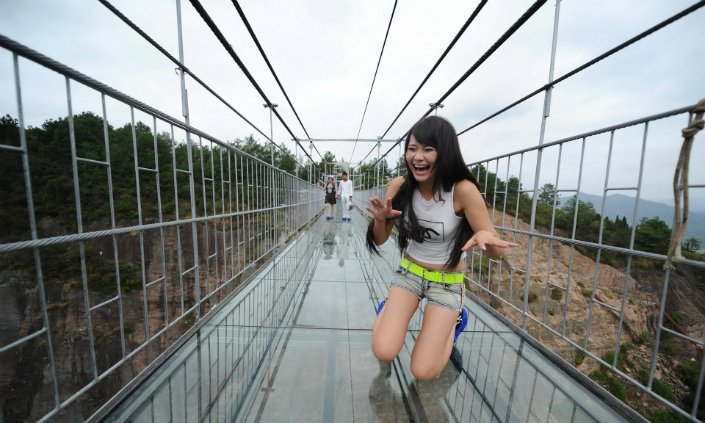 Would you dare to cross this glass suspension bridge