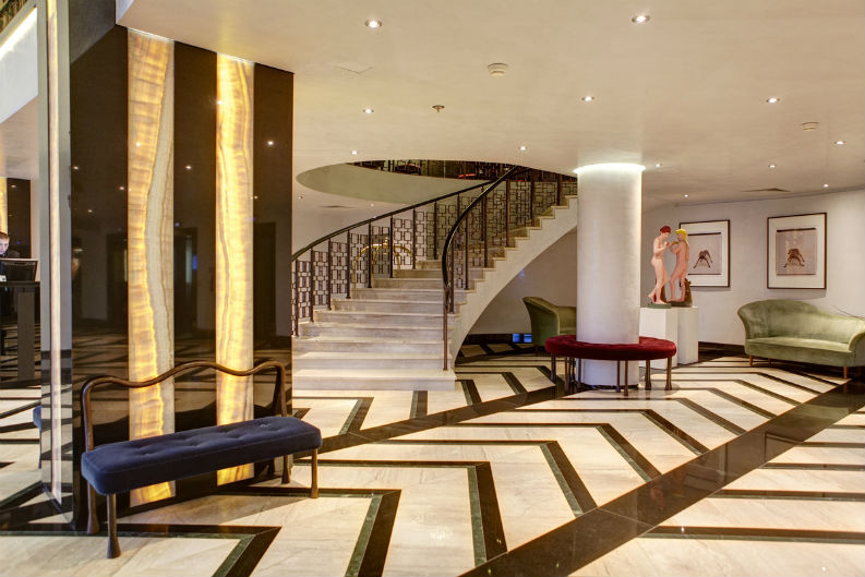 the entry hall of the Grand Hotel Sofia, with classic upholstery and colour combination