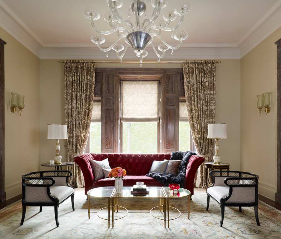 Fox-Nahem Associates, a classic living room in New York City wiht a red velvet sofa