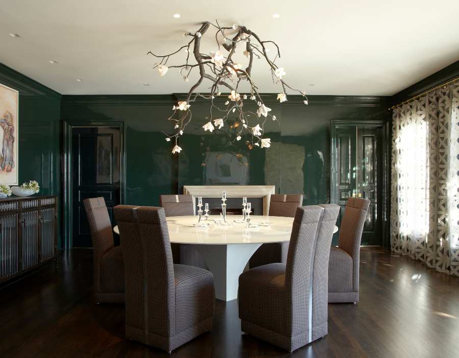 Fox-Nahem Associates, a dining room with a green wall and a marble dining table
