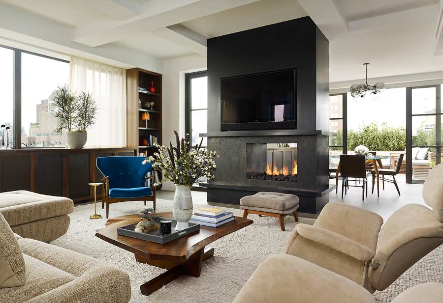 Fox-Nahem Associates, mid-century modern living room with neutral decor and a blue velvet armchair