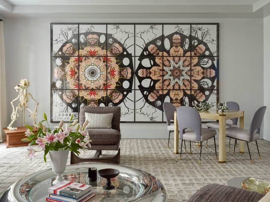 Fox-Nahem Associates, A contemporary living room in New York City with a wall art piece, a neutral rug and violet dining chairs