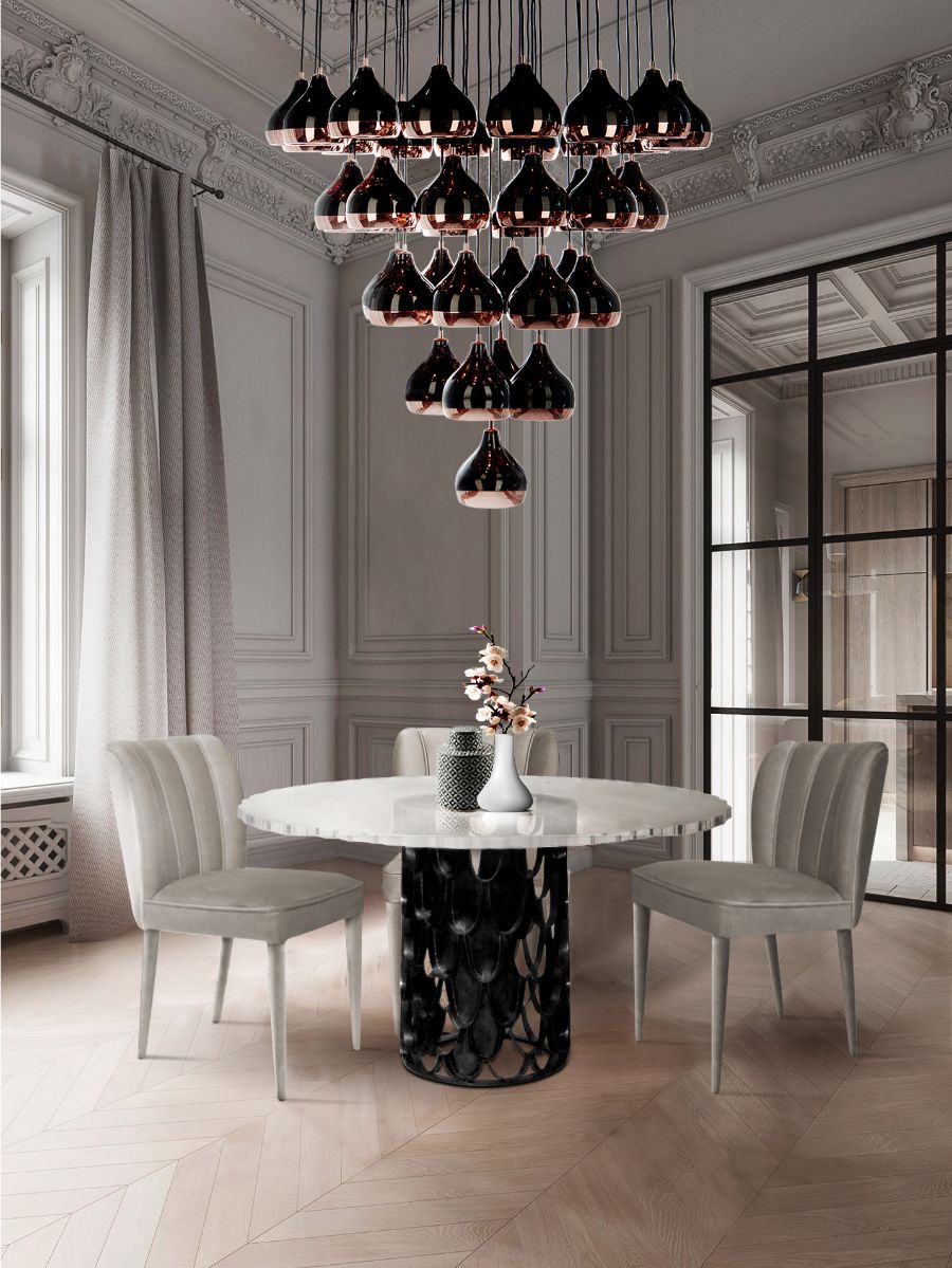 contemporary dining room with grey velvet dining chairs and round dining table
