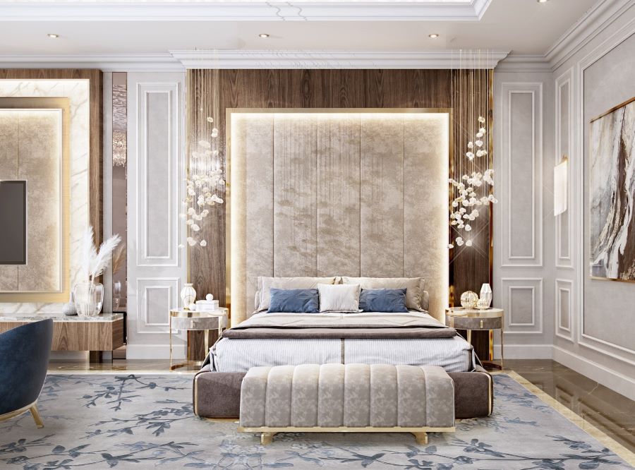 modern bedroom, blue and white pillows, blue and white rug, blue armchair, gold bedside table , luna