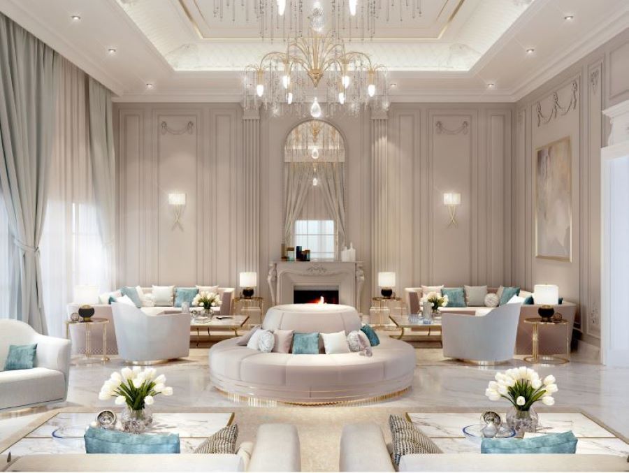 modern living room, white sofas with pink, blue and white pillows, white armchairs, gold side table, gold and white centre table, gold suspension light , luna