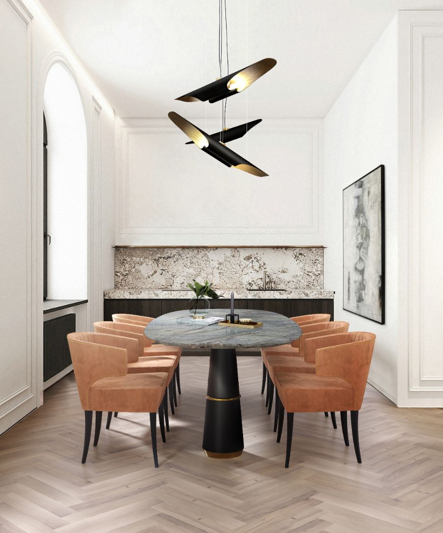 modern contemporary dining room with orange dining chairs and black marble dining table
