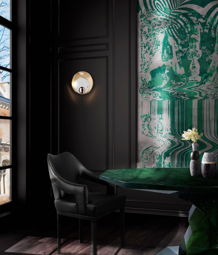 dark dining room setting with black leather dining chair and green dining table
