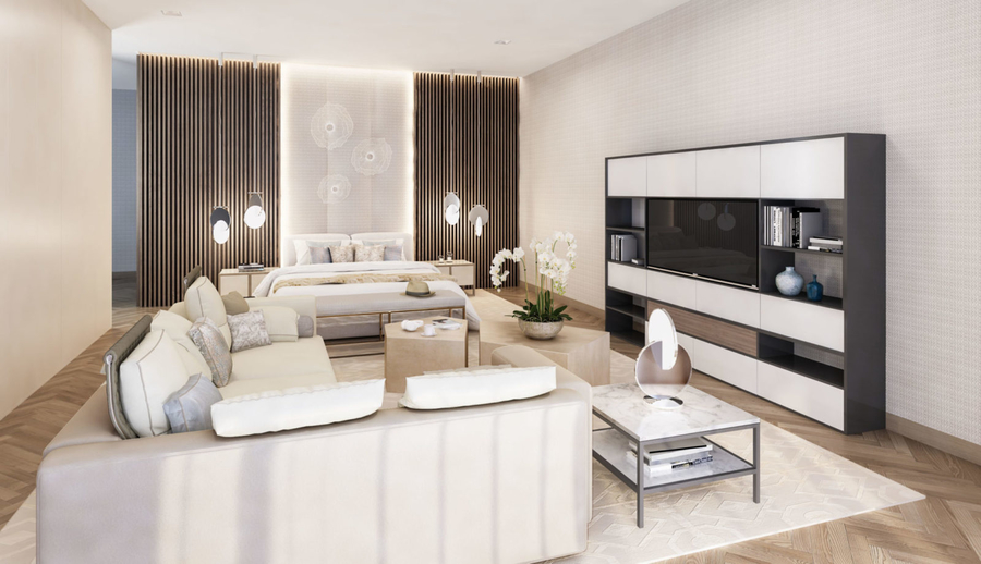 A living room furnished with white upholstery completed with some center tables and a custom rug.