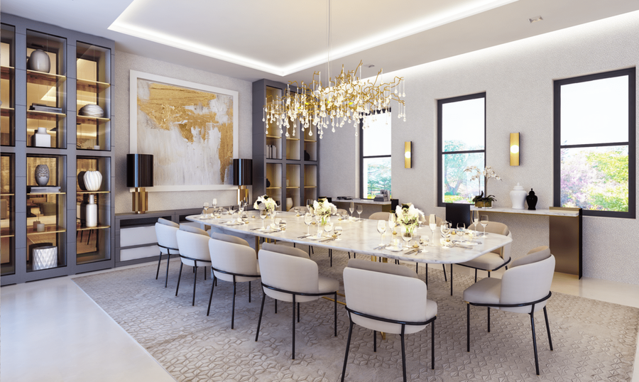 A dining room furnished with a white marble dining table, some bespoke upholstery, completed with some gold details.