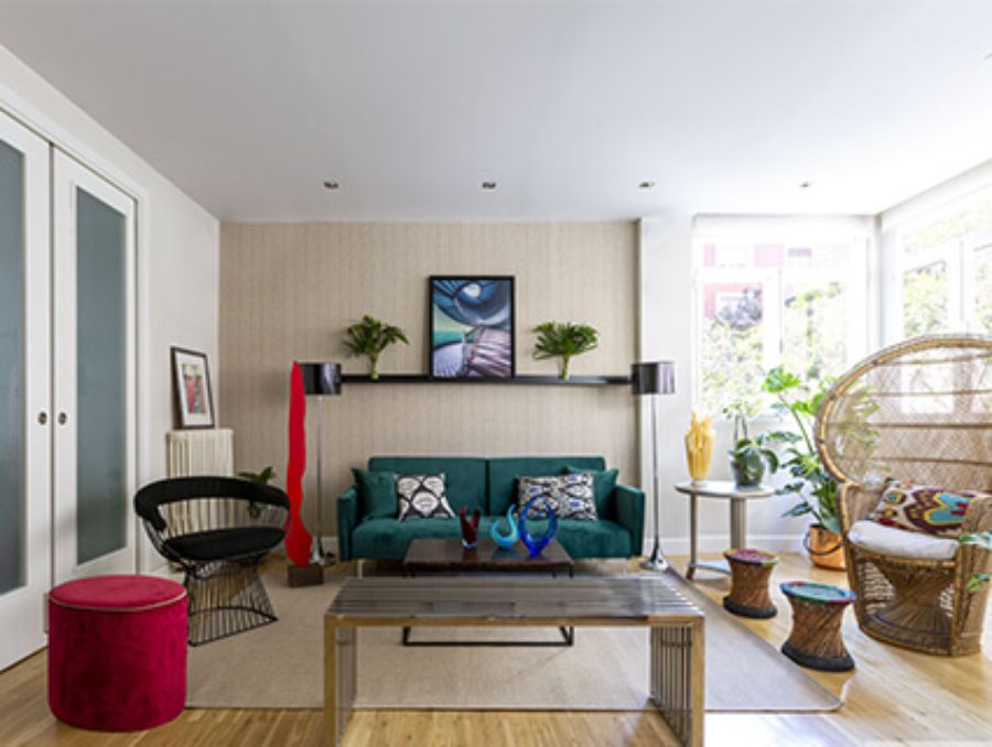 living room by alterespacio with green sofa and artisanal chairs