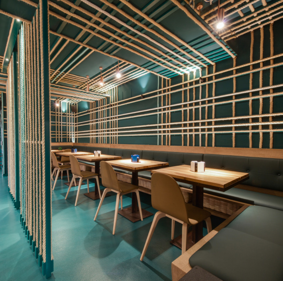 restaurant with brown dining chairs and rectangular dining tables