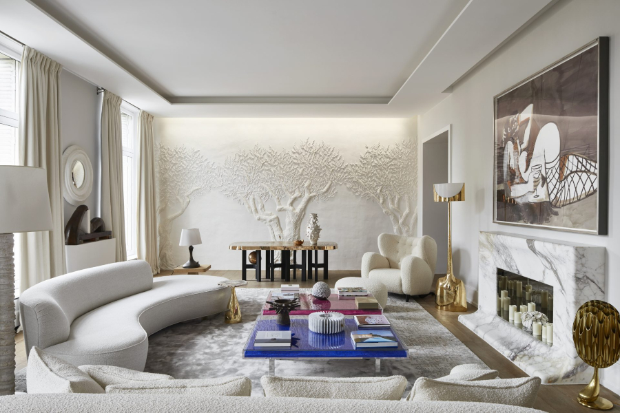 Modern Interior Design by Stéphanie Coutas. modern living room with a curved sofa, a white armchair and gold details.