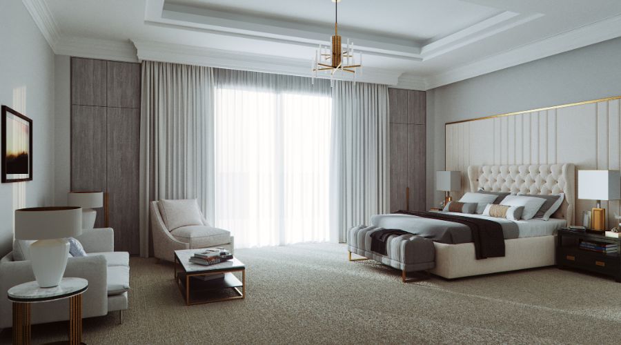 NP Design creates a clean bedroom design with a comfy bed and a living space.
