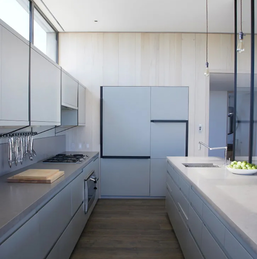 Interior Design Ideas with Yabu Pushelberg. This kitchen is greys and wood details. the cabinets are in grey and the walls in wood. 