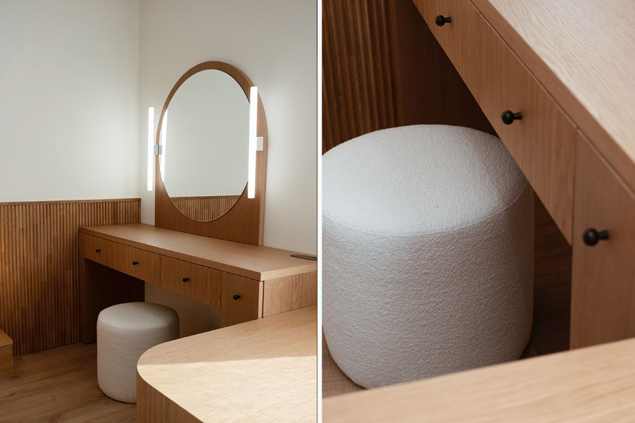 vanity by franquet barrau with wooden table and oval mirror, white stool