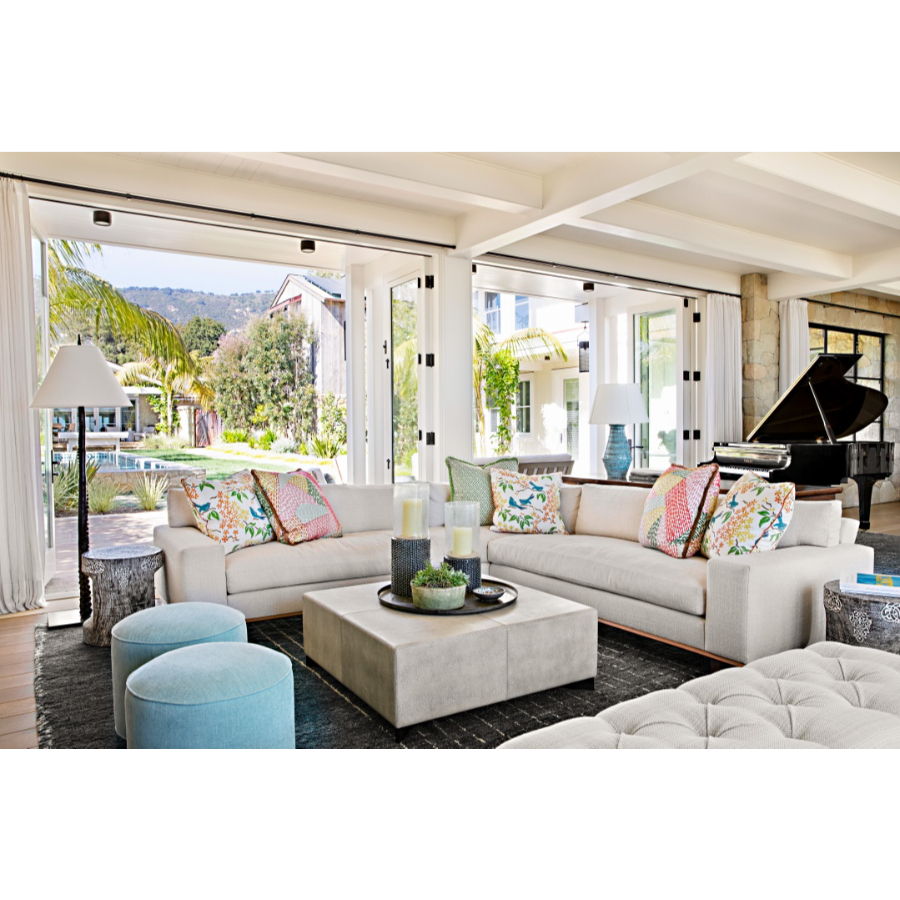 Modern Interior Design: Colorful living room, composed by a white sofa, colorful pillows, a designer rug, and beautiful lighting, you can also see the piano on the background