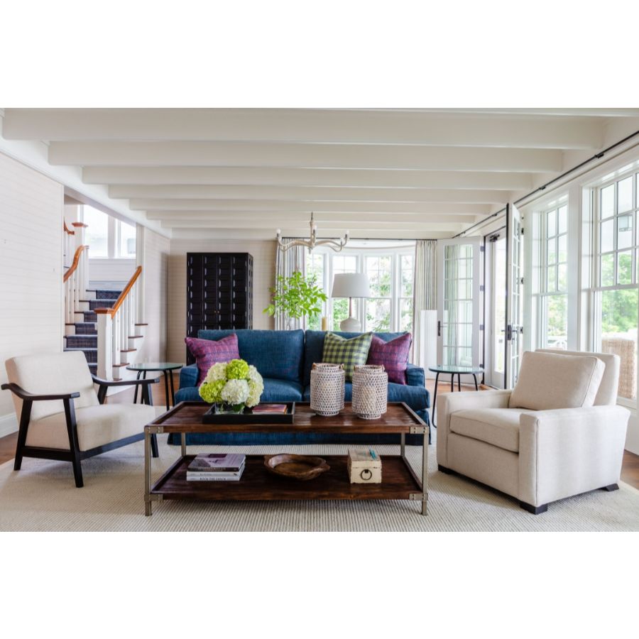 Modern Interior Design: This living room is based on neutral colors, the blue sofa brings some color to the big picture