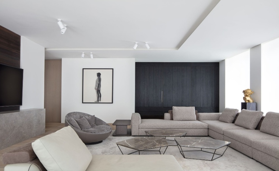 The Best Interior Design Ideas By Audax. This modern and neutral living room has a neutral sofa, a grey marble coffee table and a neutral rug. 