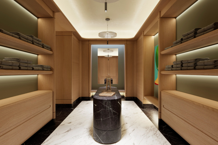 closet by Grupo Cosmic with marble table and brown closets