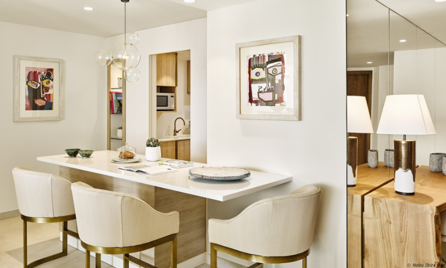 dining room by Proffetional Finishing Design with white table and white chairs