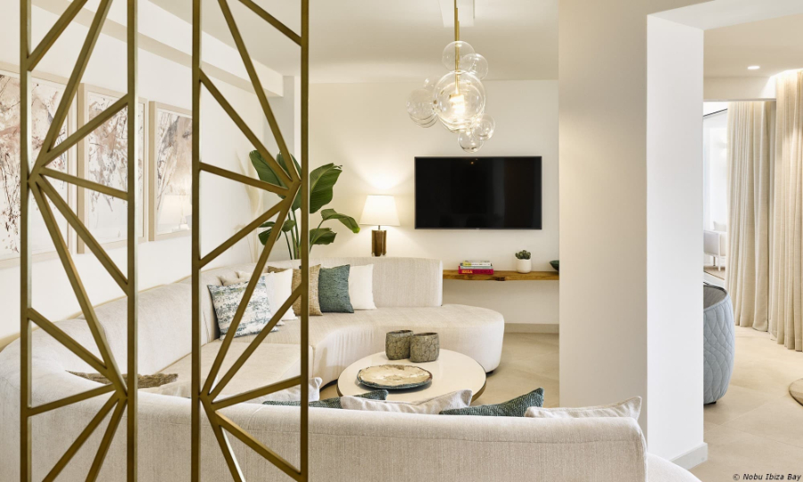 living room by Proffetional Finishing Design with white sofa and glassed pendant light