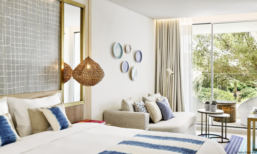 Bedroom by Proffetional Finishing Design with beige headboard, grey sofa, artisanal lights and white coffee tables