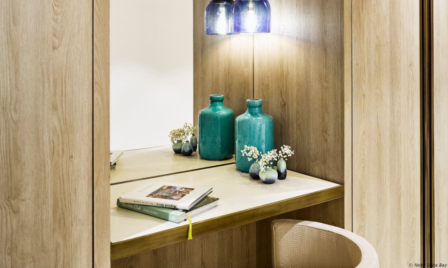 bedroom by Proffetional Finishing Design with wooden desk and blue decorative items