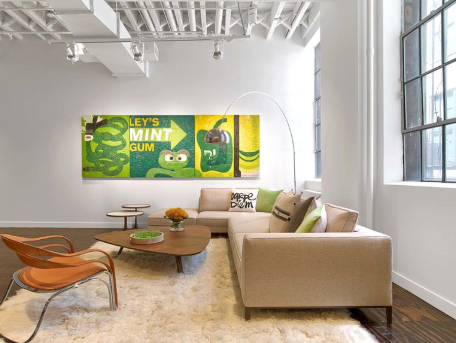 Rottet Studio: Architecture And Design In Texas. This is a living area, there's a big sofa, a center table, two side tables, an armchair, and a floor light. Green is the predominant color on the design of this room.