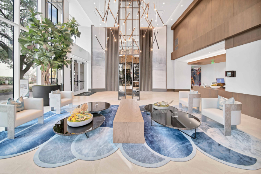 SJL Design Group: Interior Design In Texas. A wide living room with a large rug in blue tones.