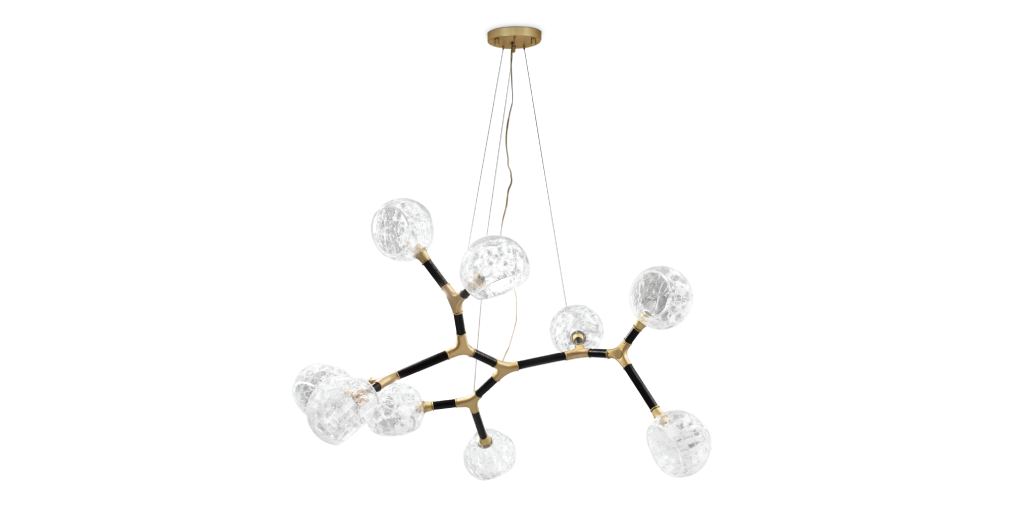 Horus Irregular Suspension Light with black lacquered brass structure and crackle glass diffusers, adding sculptural elegance to a bedroom.
