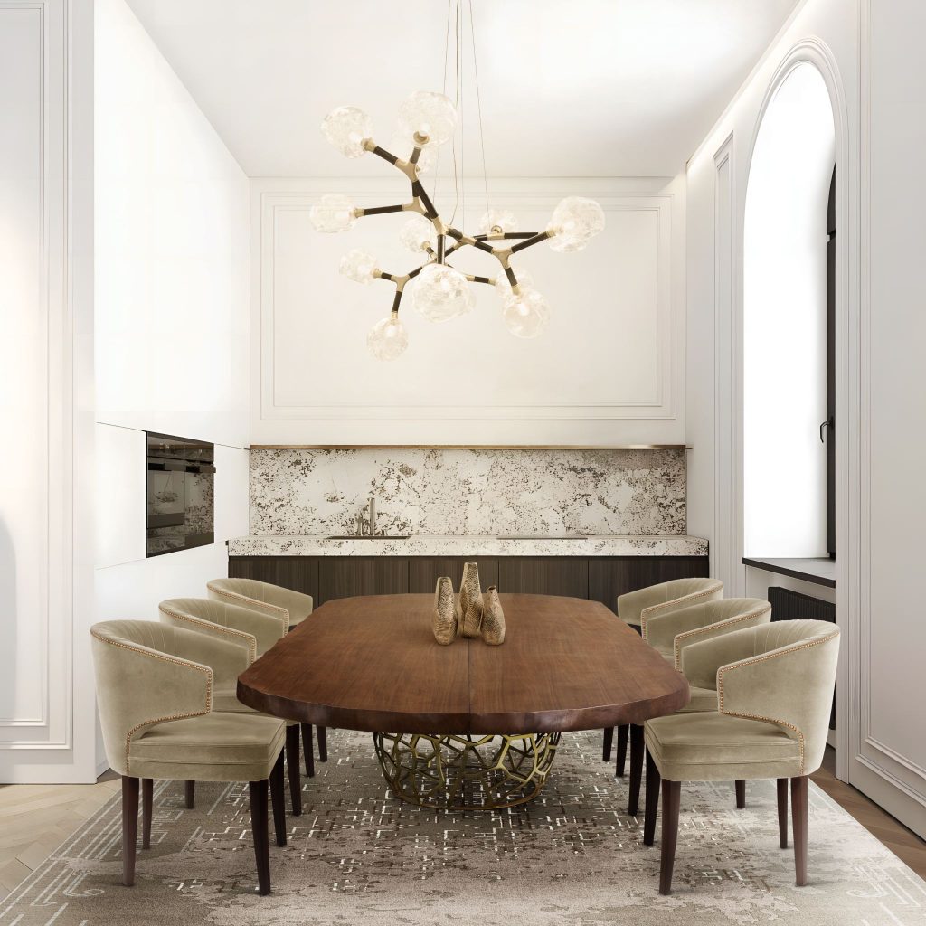 Neutral dining room with IBIS Dining Chairs, APIS Oval Dining Table, HORUS Irregular Big Suspension Light, and RUIN Rug creating an elegant and sophisticated atmosphere.