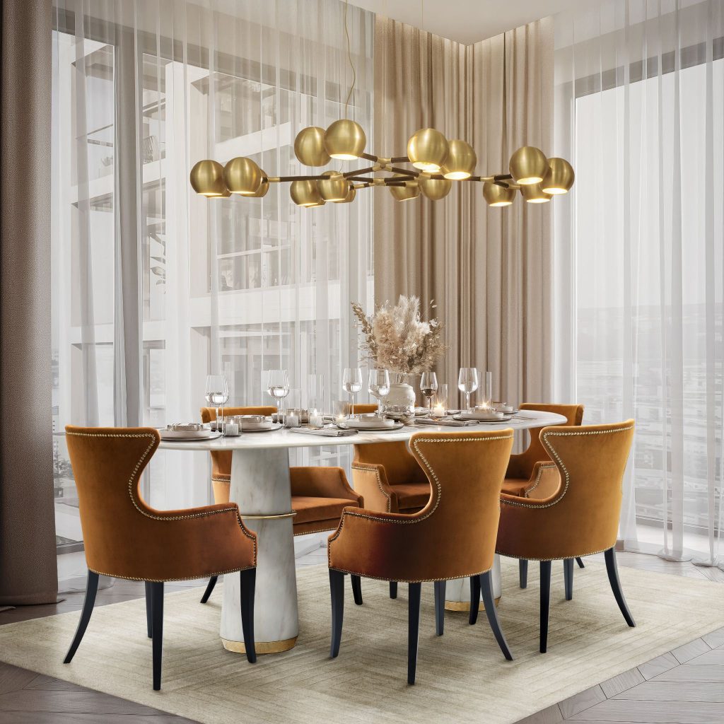 Contemporary dining room with Dukono Dining Chairs and Agra II Dining Table featuring a white Estremoz marble top and gold details, creating a luxurious and elegant setting.