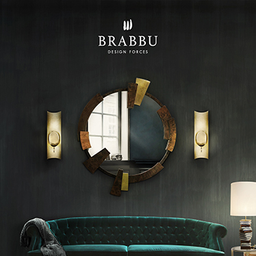 A green emerald sofa with capitoné in a modern home décor. This fierce living room set counts as well with the gold from the wall lamps and round mirror to contrast with the other pieces.